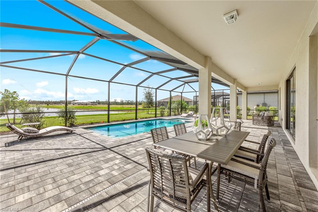 14351 Lagoon Lane Babcock Ranch, FL 33982 - Photo 35 of 39 a view of a patio with a table and chairs