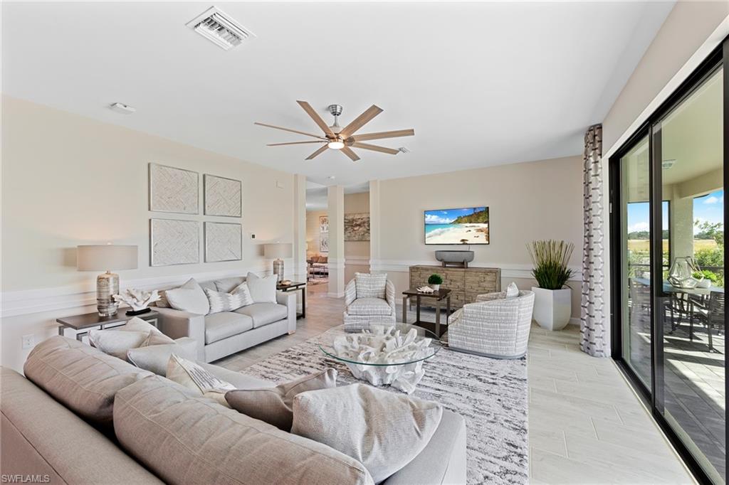 14351 Lagoon Lane Babcock Ranch, FL 33982 - Photo 6 of 39 a living room with furniture and a large window