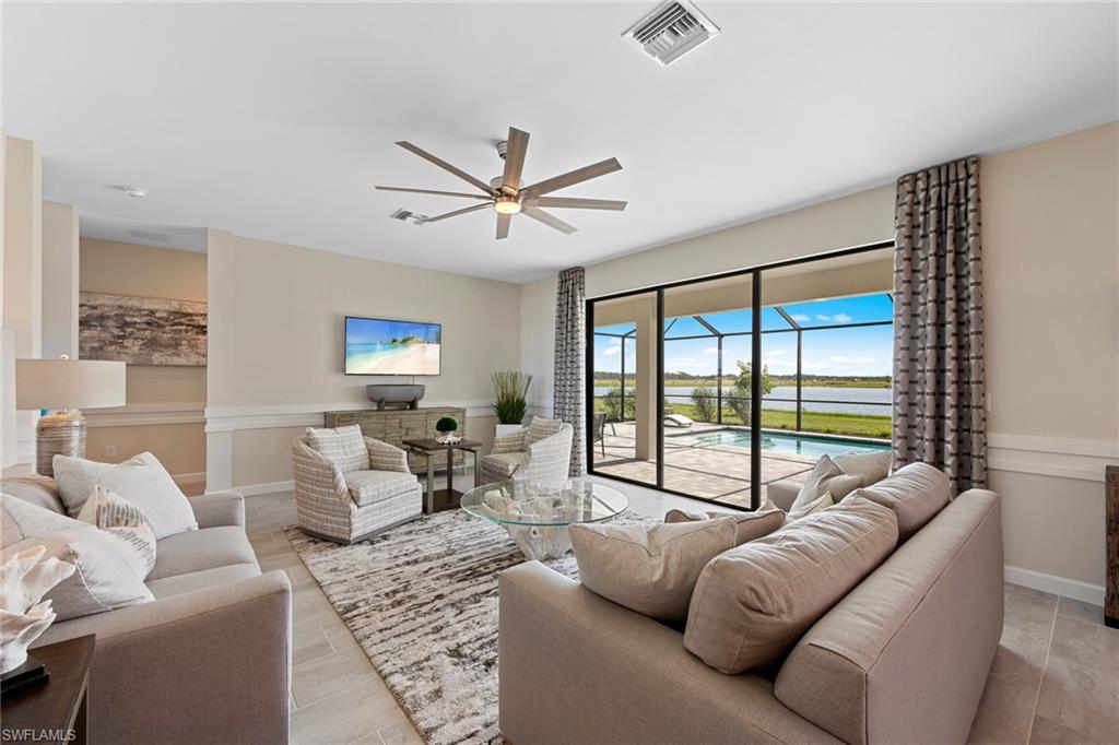 14351 Lagoon Lane Babcock Ranch, FL 33982 - Photo 7 of 39 a living room with furniture and a large window