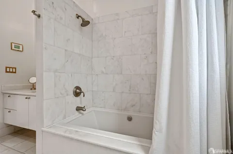 a bathroom with a shower and a bathtub