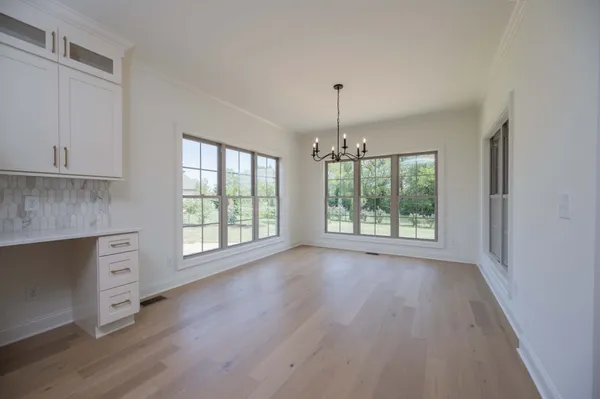 a kitchen with stainless steel appliances a refrigerator sink and cabinets
