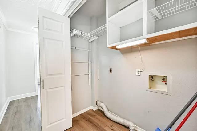 a view of a room with wooden floor