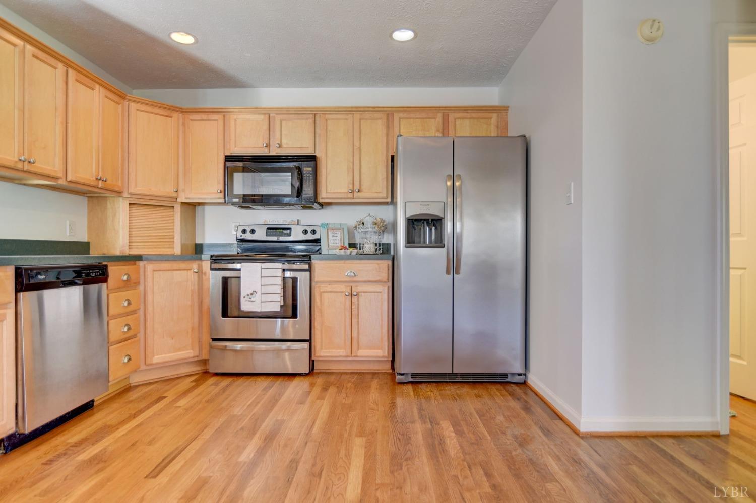 3636 White Road Forest, VA 24551 - Photo 11 of 44 a kitchen with white cabinets and stainless steel appliances