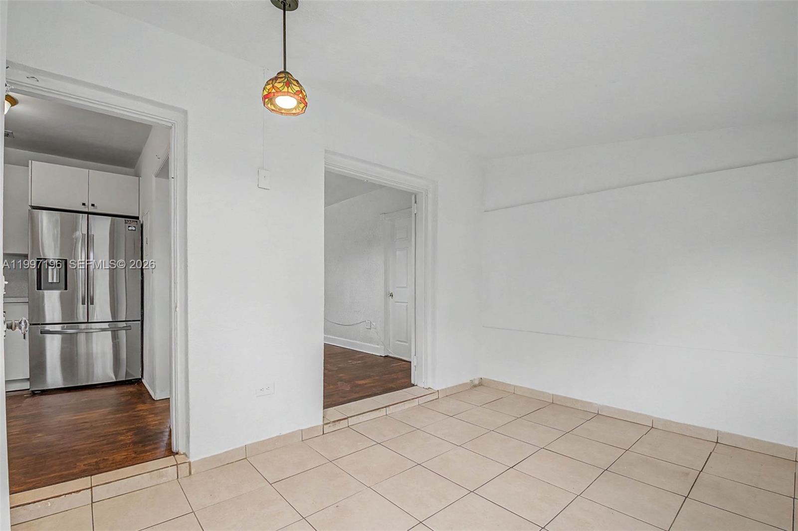 3951 Southwest 2nd Terrace Miami, FL 33134 - Photo 13 of 32 a view of a room with cabinet and floor to ceiling window