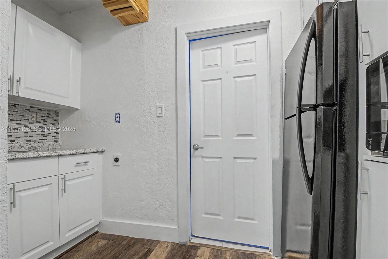 3951 Southwest 2nd Terrace Miami, FL 33134 - Photo 21 of 32 a view of cabinets with wooden floor