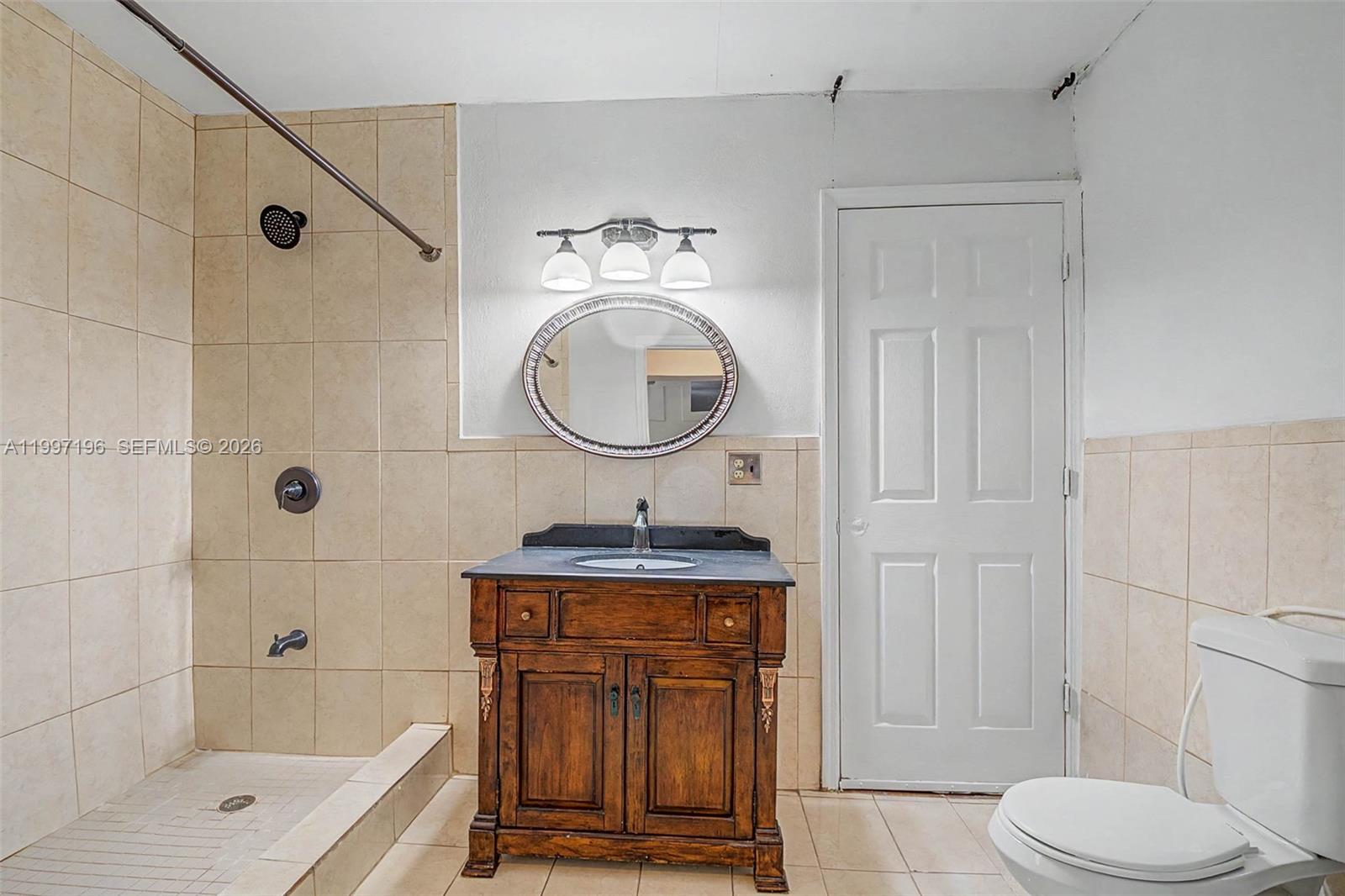 3951 Southwest 2nd Terrace Miami, FL 33134 - Photo 22 of 32 a bathroom with a sink a toilet and shower