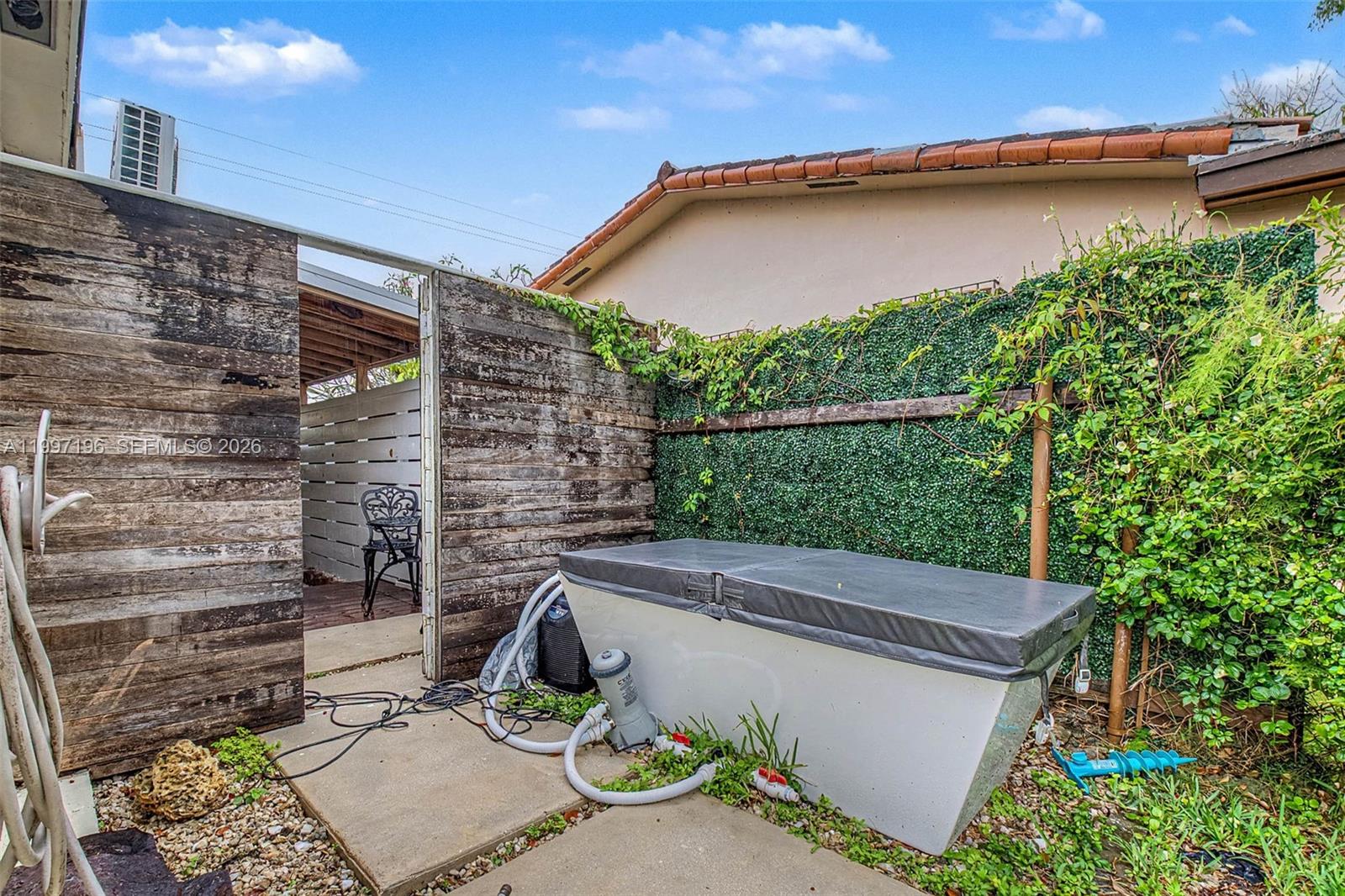 3951 Southwest 2nd Terrace Miami, FL 33134 - Photo 24 of 32 a view of a backyard with plants and a patio