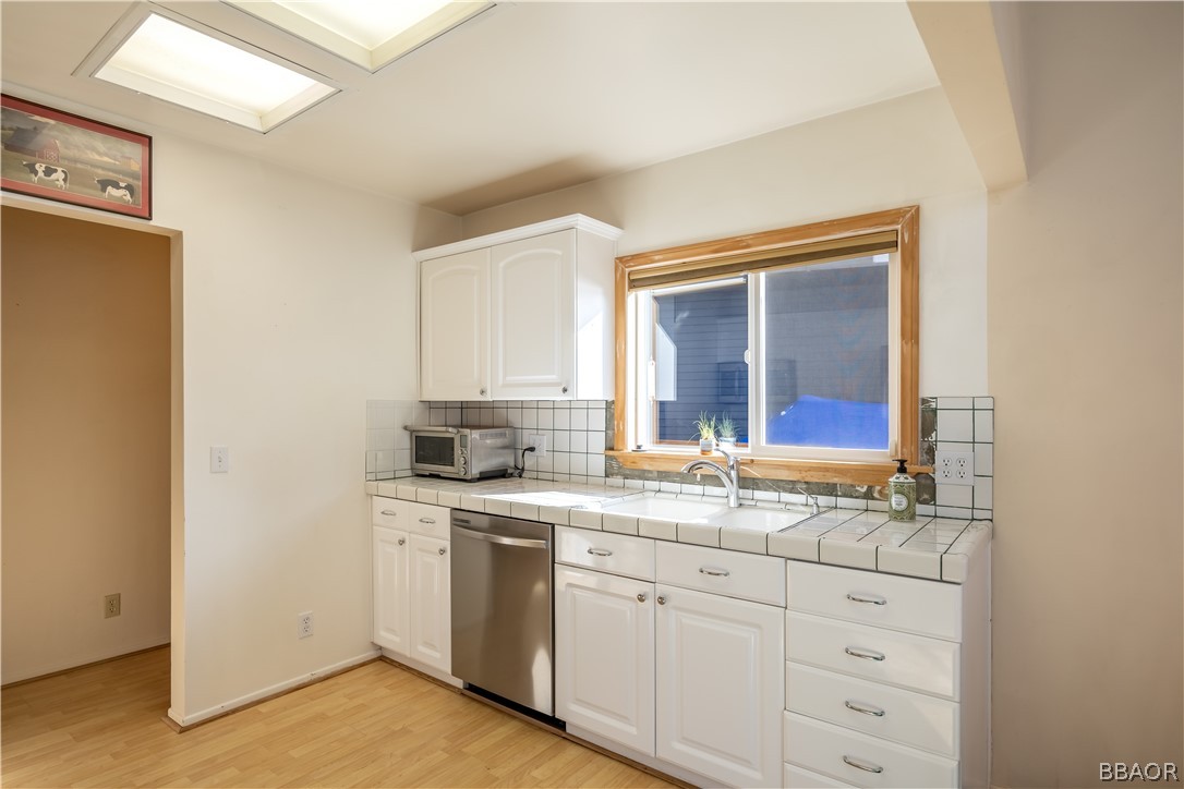 136 Round Drive Big Bear Lake, CA 92315 - Photo 15 of 45 a kitchen with a sink cabinets and window