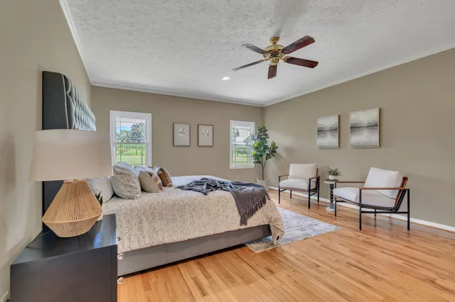 a bedroom with a large bed and furniture