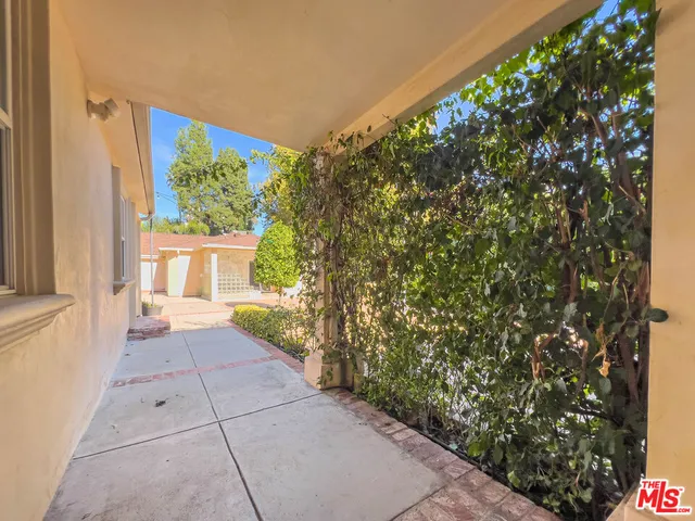 a view of entryway with flower pots
