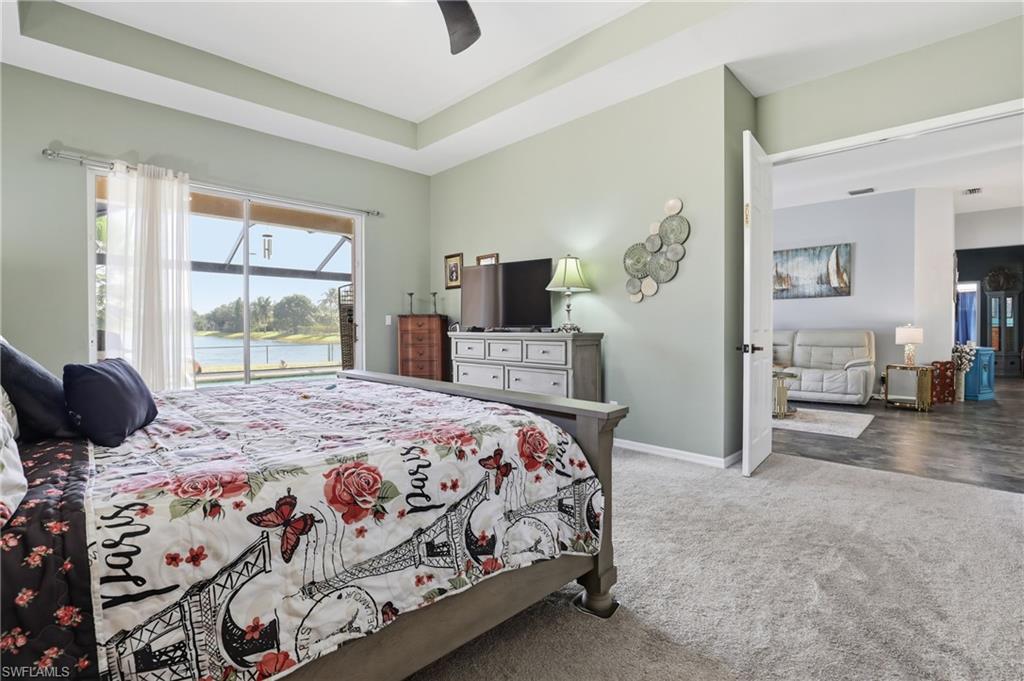 3236 Potomac Court Naples, FL 34120 - Photo 21 of 47 a bedroom with a bed and wooden floor