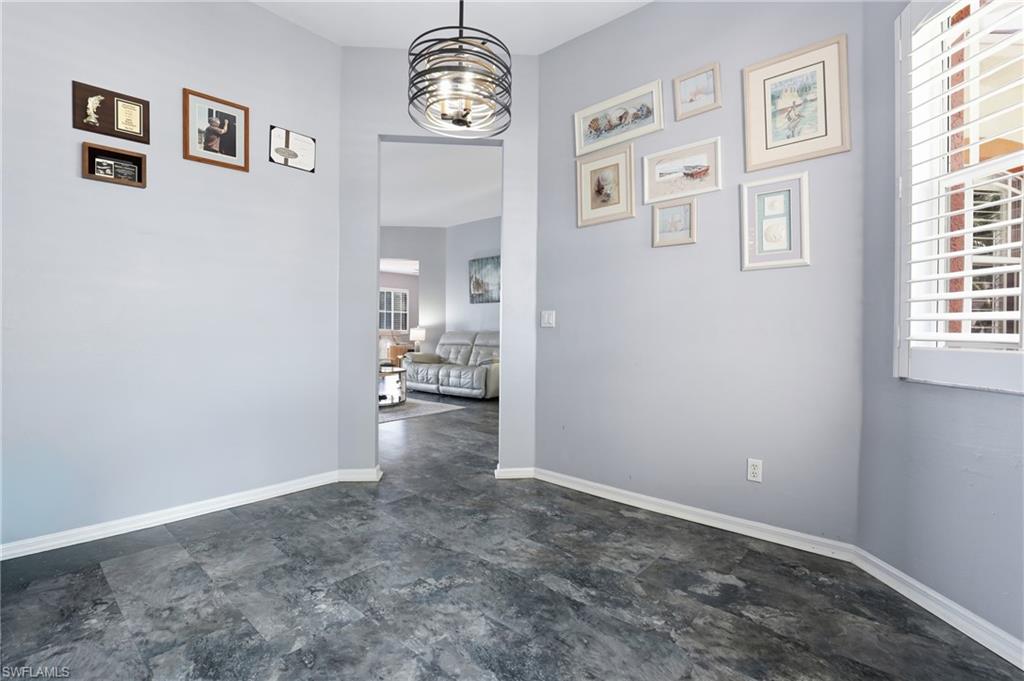3236 Potomac Court Naples, FL 34120 - Photo 33 of 47 a view of empty room with wooden floor