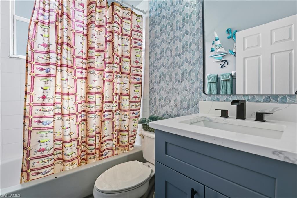 3236 Potomac Court Naples, FL 34120 - Photo 35 of 47 a bathroom with a sink toilet and shower