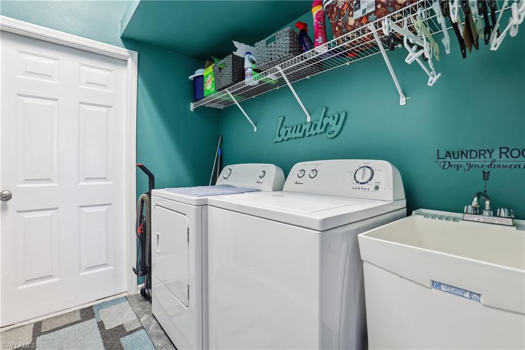 3236 Potomac Court Naples, FL 34120 - Photo 36 of 47 a utility room with dryer and washer