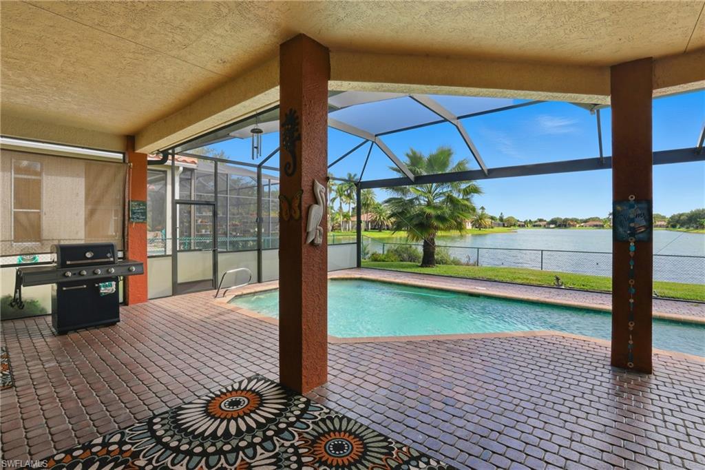 3236 Potomac Court Naples, FL 34120 - Photo 39 of 47 a bedroom with a bed and large windows