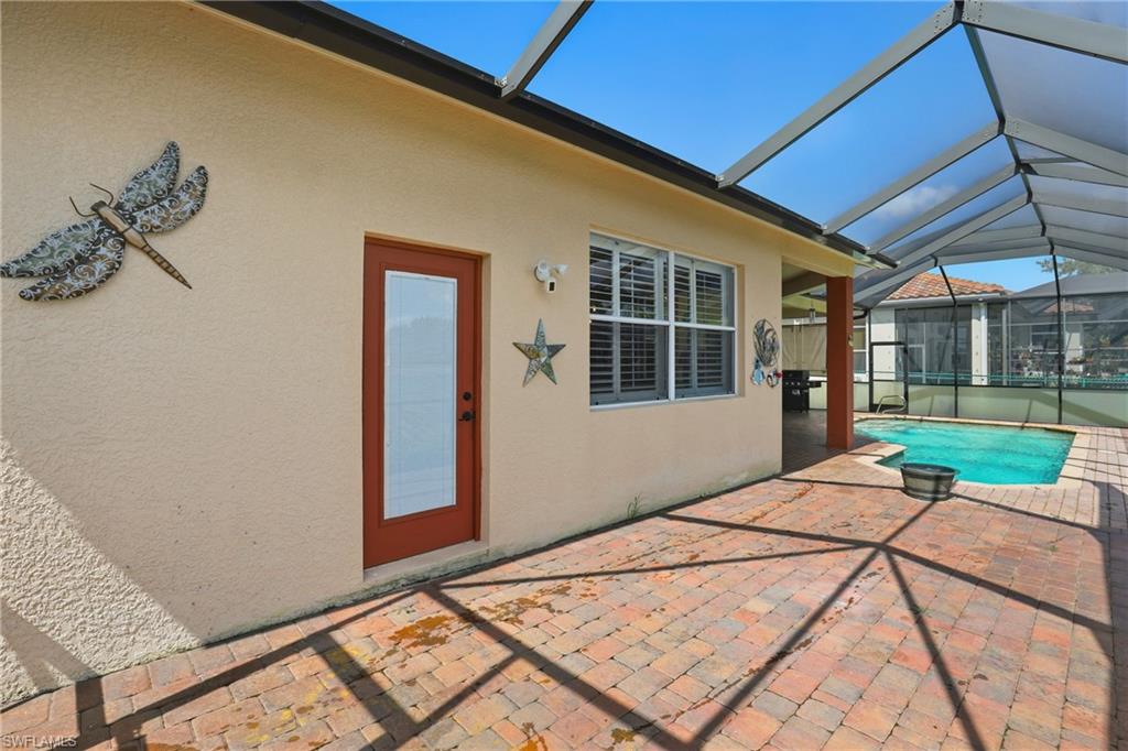 3236 Potomac Court Naples, FL 34120 - Photo 42 of 47 a backyard of a house with barbeque oven