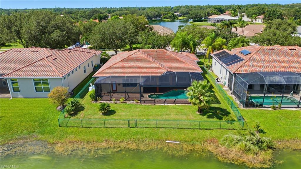 3236 Potomac Court Naples, FL 34120 - Photo 46 of 47 an aerial view of a house with swimming pool patio and outdoor seating