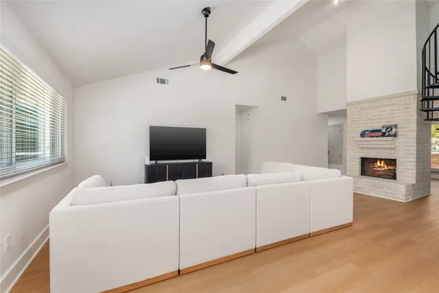 a view of entryway livingroom and hall with wooden floor