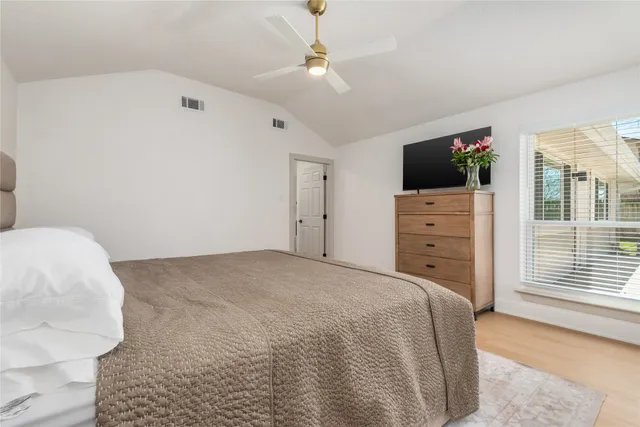 a bathroom with a mirror and a shower