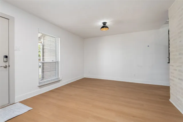a bathroom with a toilet and a bath tub