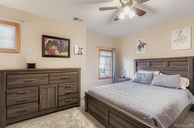 a bedroom with a bed and a dresser