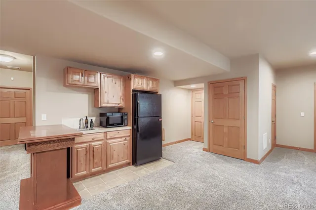 a kitchen with stainless steel appliances a refrigerator stove and sink