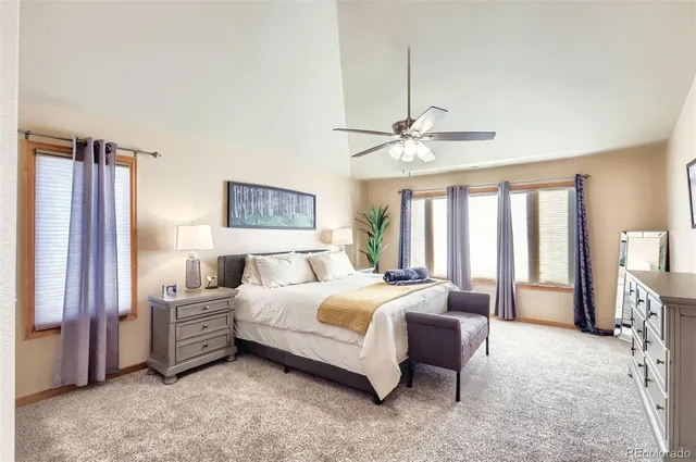 a bedroom with a bed dresser and a window