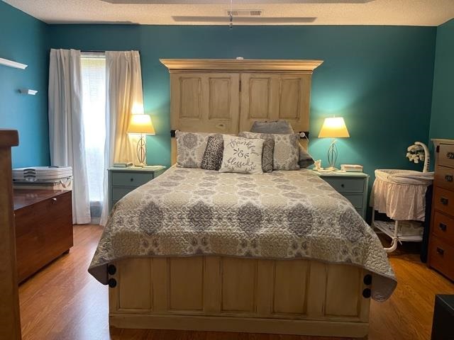 1010 Harmon Drive Atoka, TN 38004 - Photo 15 of 20 a bedroom with a bed and wooden floor