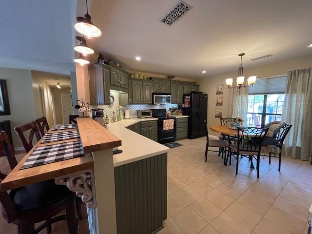 1010 Harmon Drive Atoka, TN 38004 - Photo 6 of 20 a large kitchen with a table and chairs