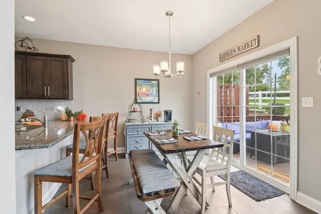a view of a dining room with furniture window and outside view