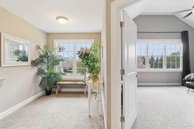 a view of entryway with a bed and a window