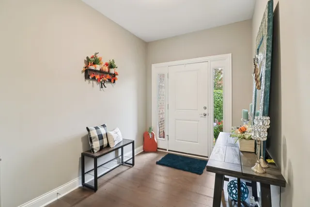 a view of a workspace with furniture and wooden floor