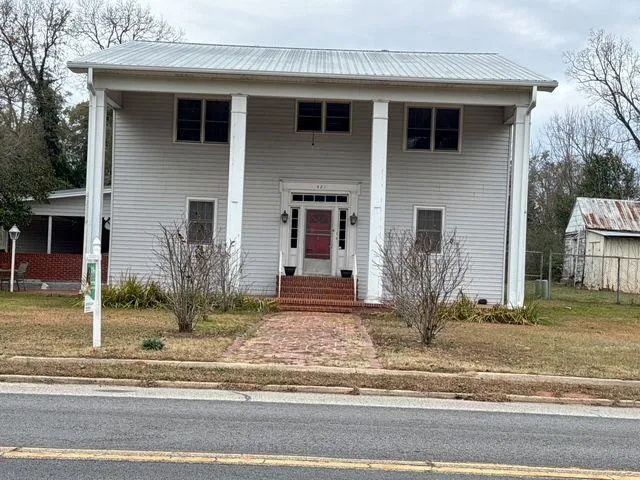 a front view of a house with garage
