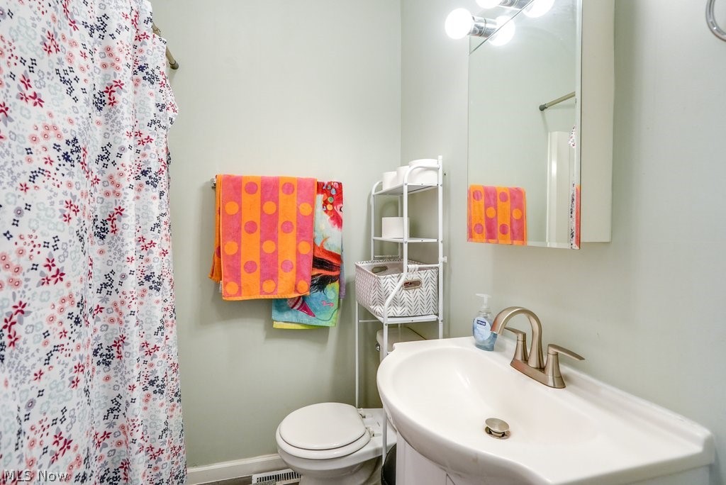 195 Canton Road Akron, OH 44312 - Photo 22 of 29 Bathroom featuring tile floors, vanity, and toilet