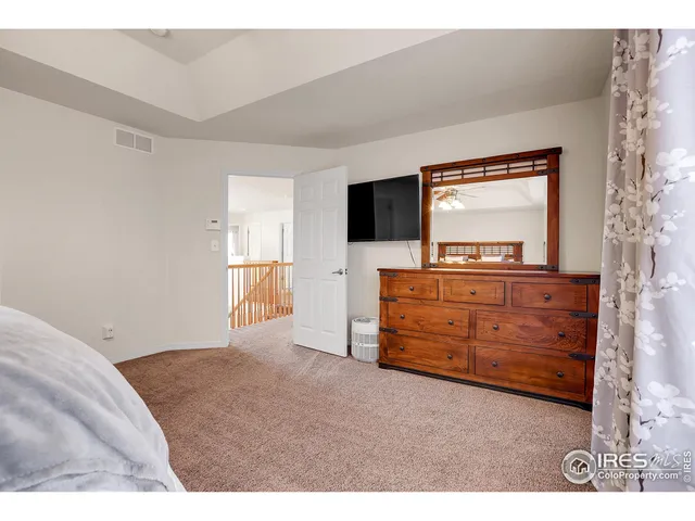 a living room with furniture and flat screen tv