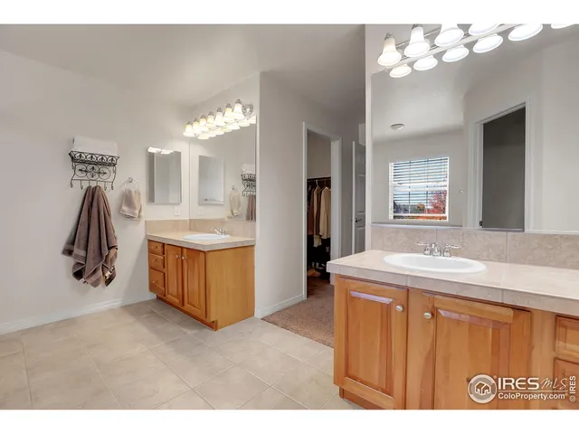 a bathroom with a sink vanity and a mirror