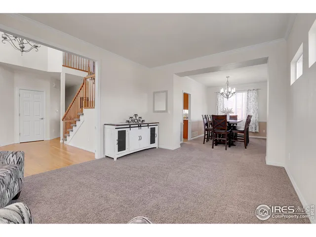 a view of livingroom with furniture and workspace