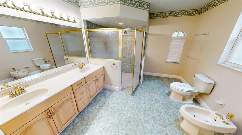 2244 Mauritania Road Punta Gorda, FL 33983 - Photo 15 of 46 a bathroom with a double vanity sink mirror and toilet