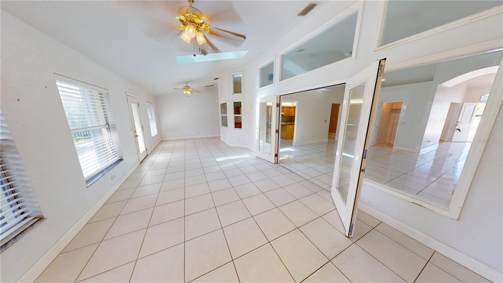 2244 Mauritania Road Punta Gorda, FL 33983 - Photo 19 of 46 a view of entryway with stairs and wooden floor
