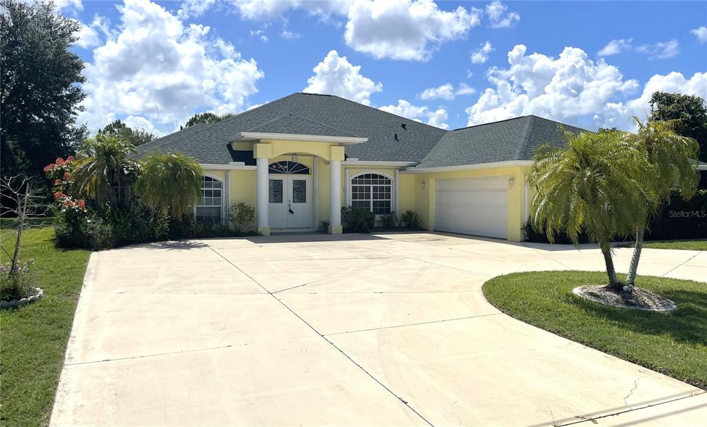 2244 Mauritania Road Punta Gorda, FL 33983 - Photo 2 of 46 a front view of a house with a yard
