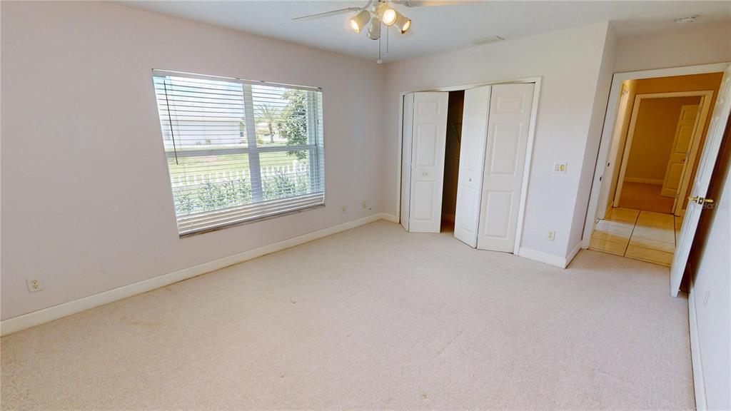 2244 Mauritania Road Punta Gorda, FL 33983 - Photo 21 of 46 an empty room with windows and entrance
