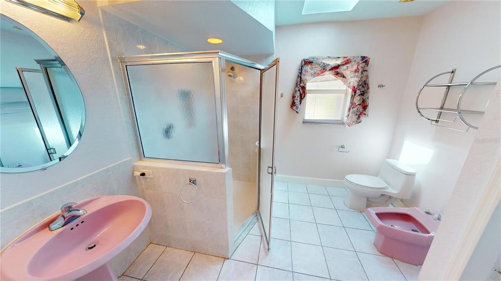 2244 Mauritania Road Punta Gorda, FL 33983 - Photo 23 of 46 a bathroom with a granite countertop sink and a mirror