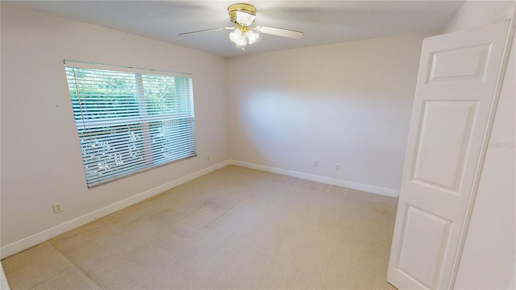 2244 Mauritania Road Punta Gorda, FL 33983 - Photo 25 of 46 an empty room with a window and a fan