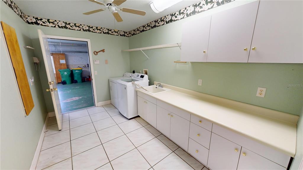 2244 Mauritania Road Punta Gorda, FL 33983 - Photo 26 of 46 a bathroom with a sink a mirror and bathtub