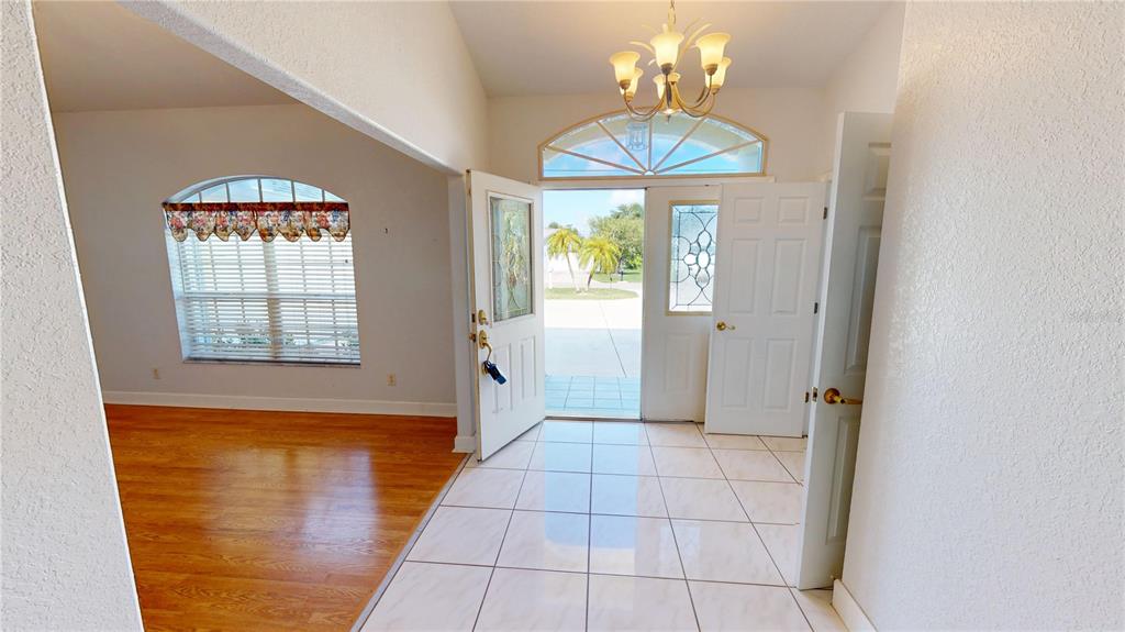 2244 Mauritania Road Punta Gorda, FL 33983 - Photo 3 of 46 a view of an entryway with a chandelier