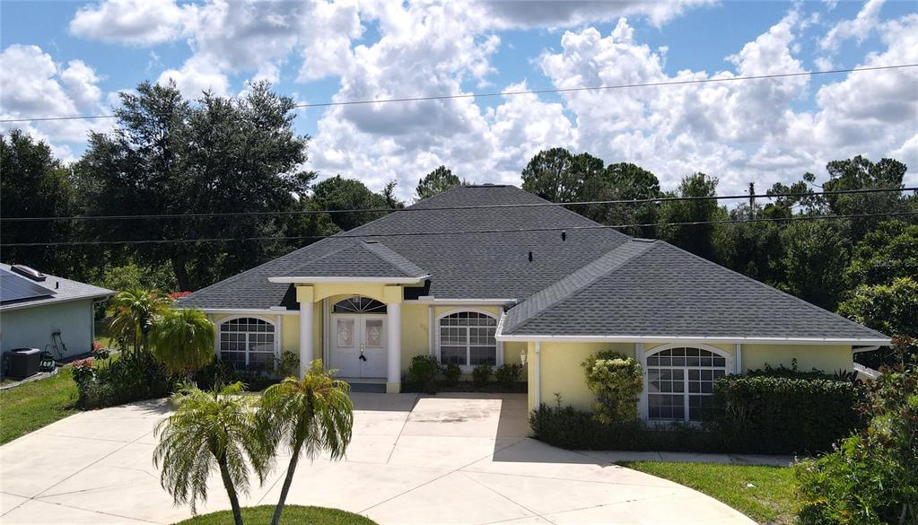 2244 Mauritania Road Punta Gorda, FL 33983 - Photo 31 of 46 a front view of a house with a garden