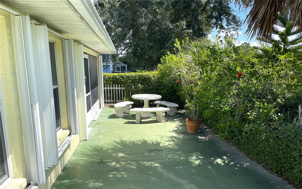 2244 Mauritania Road Punta Gorda, FL 33983 - Photo 38 of 46 a view of a chair and tables in the balcony
