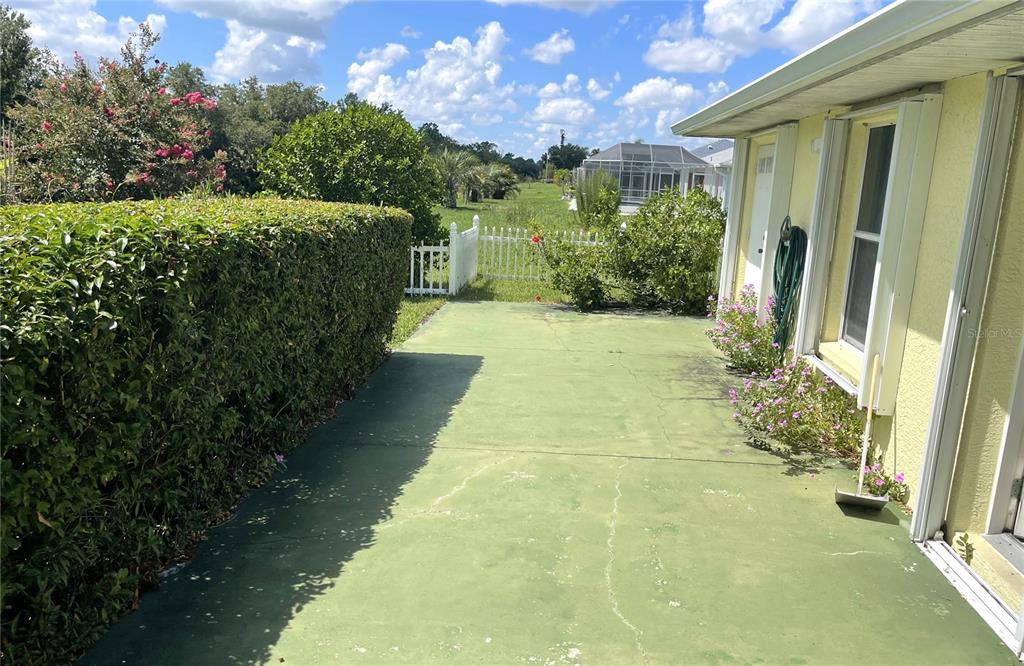 2244 Mauritania Road Punta Gorda, FL 33983 - Photo 39 of 46 a view of a pathway both side of house