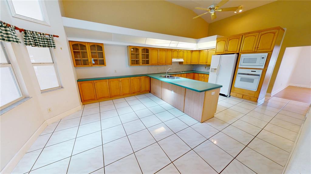 2244 Mauritania Road Punta Gorda, FL 33983 - Photo 8 of 46 a kitchen with stainless steel appliances granite countertop a sink and cabinets
