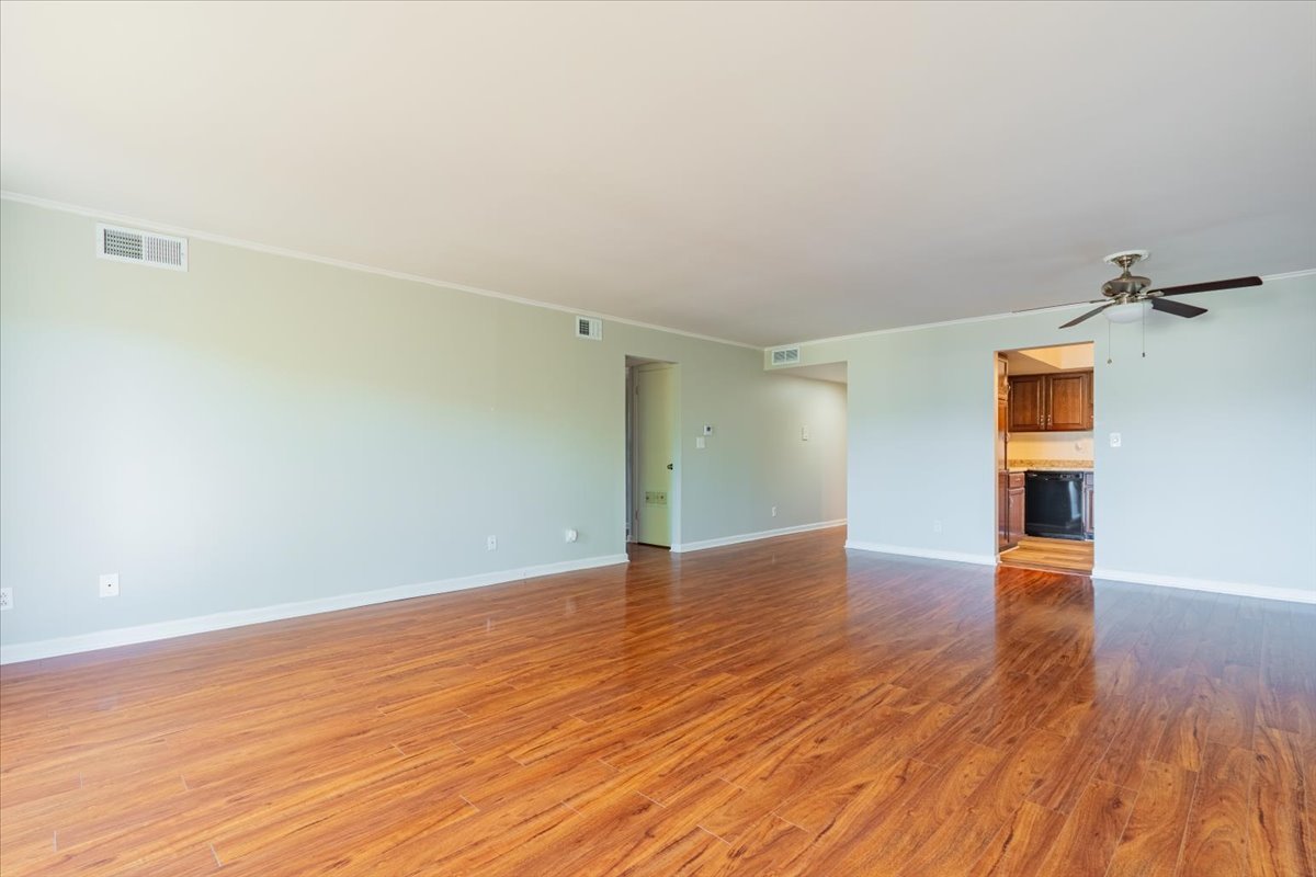 111 Rust Road, Unit 211 Bloomington, IL 61701 - Photo 4 of 15 a view of empty room with wooden floor